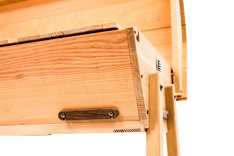 douglas fir close up of top bar hive entrance cover